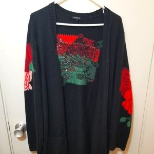 Black open front cardigan with red floral design [Torrid]